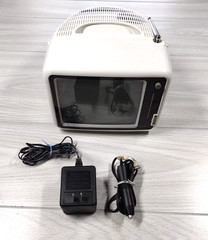 Alaron Portable 7″ Black And White TV With AM/FM Radio Incl Car Adapter TV-646RW