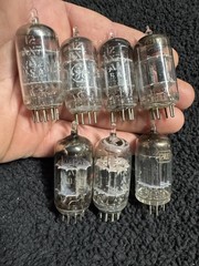 Seven 12AX7 Tubes Black And Gray Plates Untested New Old Stock GE and Others