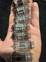 Seven 12AX7 Tubes Black And Gray Plates Untested New Old Stock GE and Others