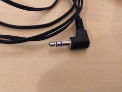 Lot of 2: Stereo In-Ear Earbuds With Windup Case.