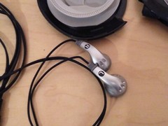 Lot of 2: Stereo In-Ear Earbuds With Windup Case.