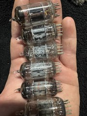 Seven 12AX7 Tubes Black And Gray Plates Untested New Old Stock GE and Others