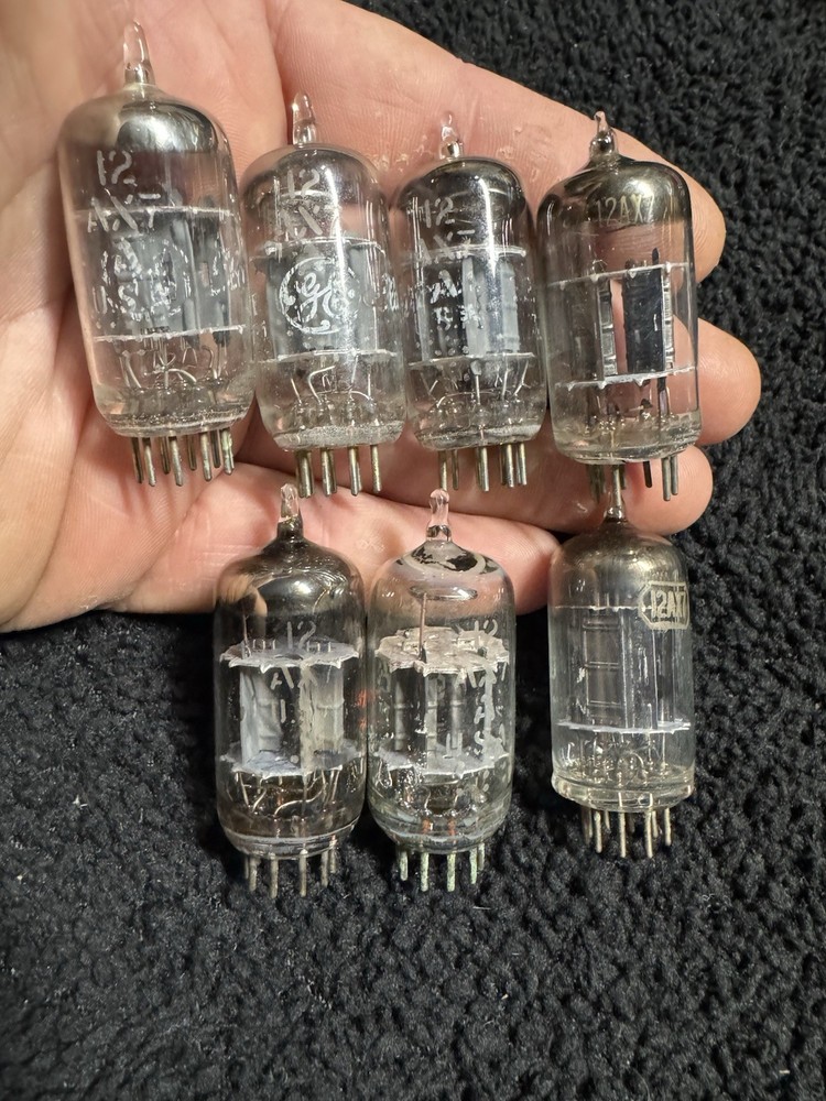 Seven 12AX7 Tubes Black And Gray Plates Untested New Old Stock GE and Others