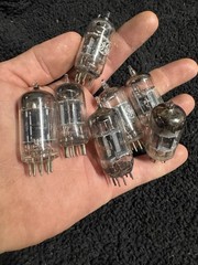 Seven 12AX7 Tubes Black And Gray Plates Untested New Old Stock GE and Others