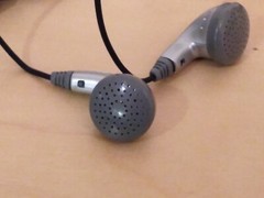 Lot of 2: Stereo In-Ear Earbuds With Windup Case.