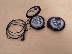Lot of 2: Stereo In-Ear Earbuds With Windup Case.