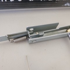 Akai GX-77 Reel to Reel – LEFT Pinch Roller Arm Assembly – Genuine Parts