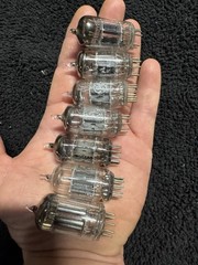 Seven 12AX7 Tubes Black And Gray Plates Untested New Old Stock GE and Others